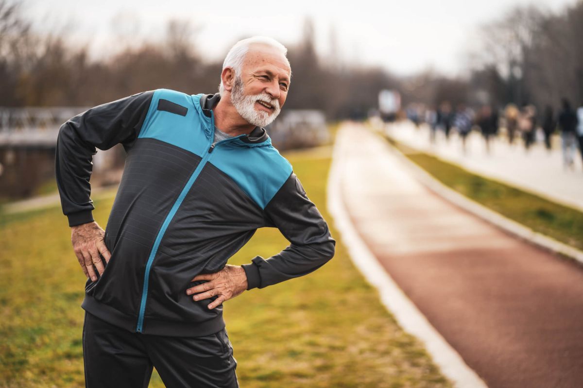 Man stretching on grass